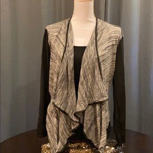 Faux leather sleeve sweater wrap
